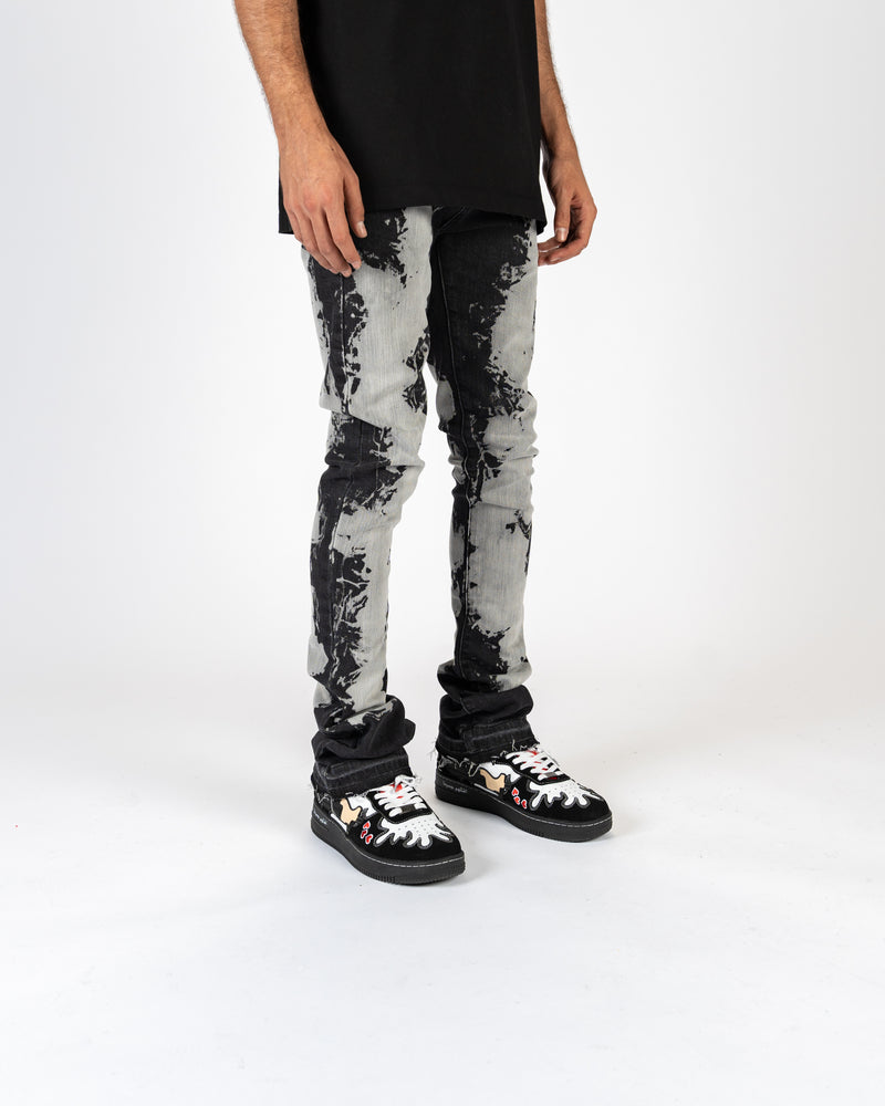 "SCARRED BY" FLARE STACK DENIM